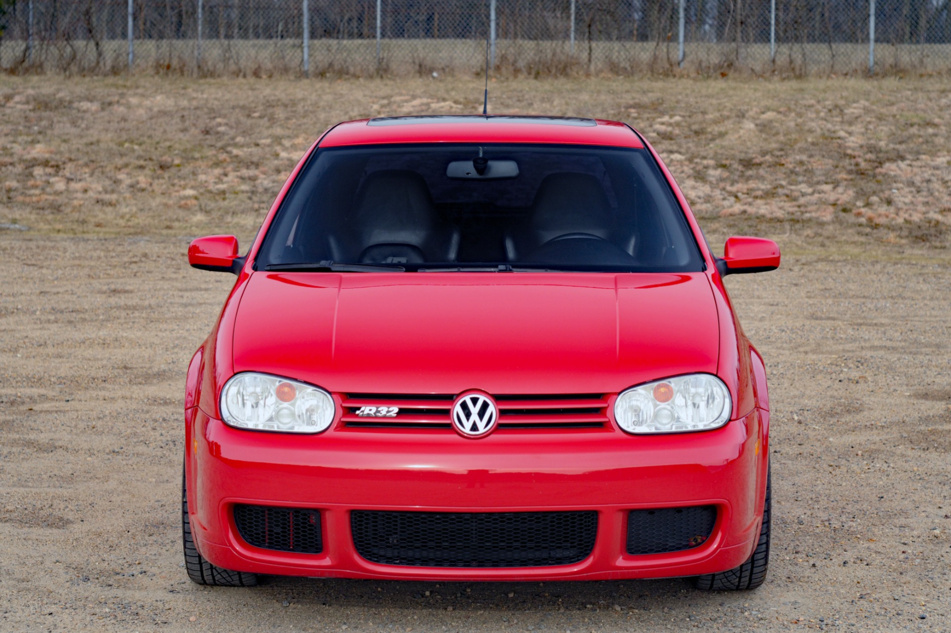 Front View of Red Volkswagen Golf 4 R32 Parked in the Streetby